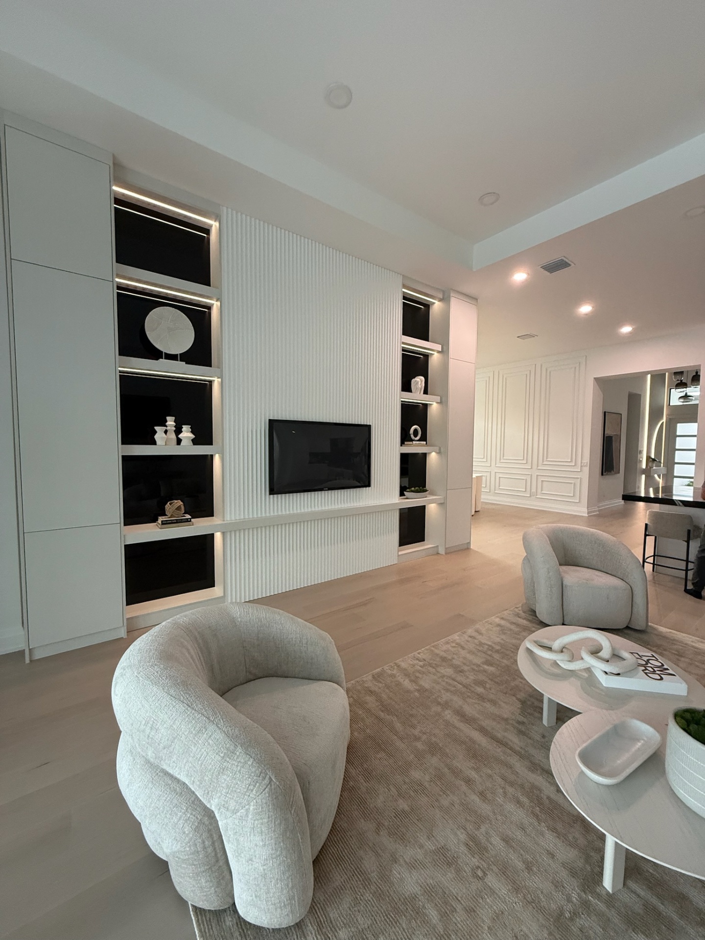 Custom millwork living room with built-in cabinetry