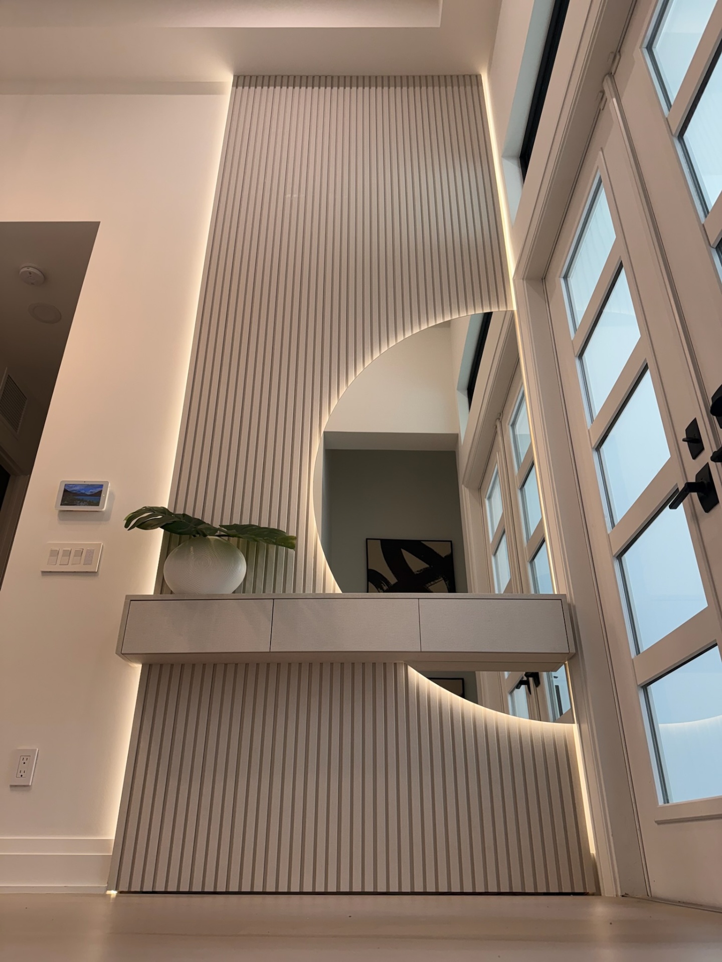 Custom foyer millwork with floating console
